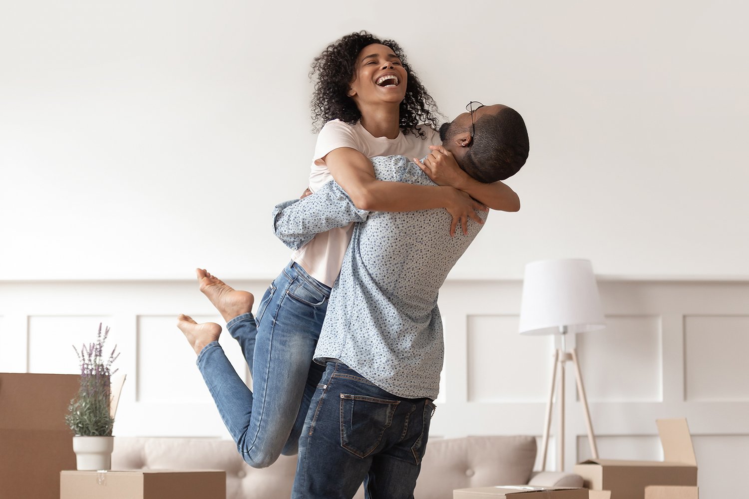 A couple celebrates moving into a home bought with an ARM.
