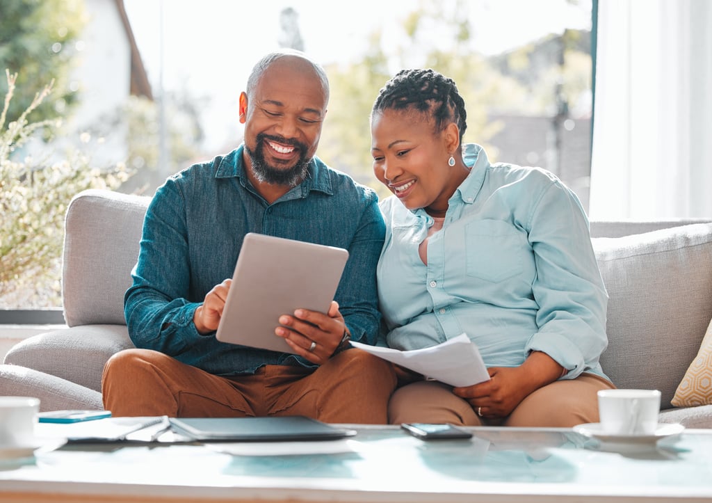A couple pays their student loan bills, refinanced through WEOKIE Federal Credit Union