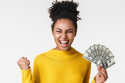 African-excited-emotional-happy-woman-posing-isolated-over-white-wall-background-holding-money