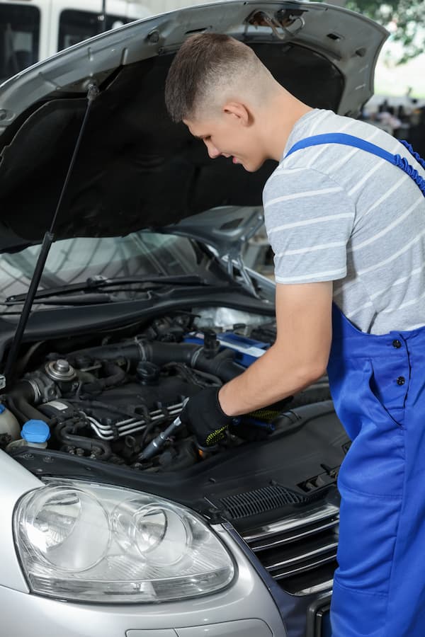 A mechanic repairing a car covered by Mechanical Breakdown Insurance.