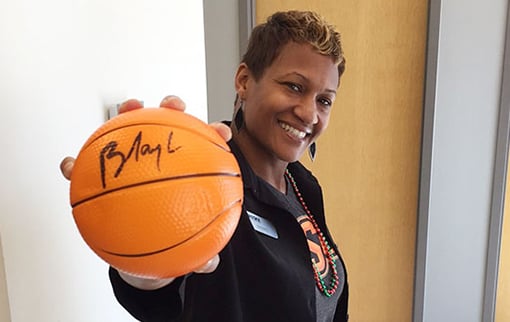 WEOKIE Employee holding a basketball