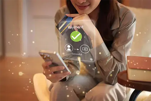 Woman reviewing a successful payment confirmation on her mobile banking app