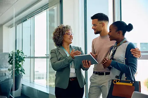 Homebuyers meeting with a mortgage specialist to explore fixed-rate loans