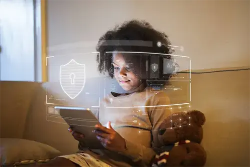 Young child using a digital tablet with a holographic security shield and data overlay