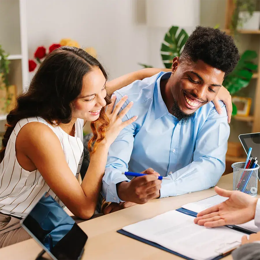People reviewing loan documents with a financial representative