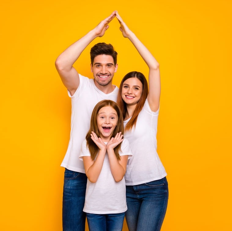 AdobeStock_285220414-Daddy-mommy-and-little-foxy-lady-under-protection-on-arms-roof-wear-casual-outfit-isolated-yellow-background