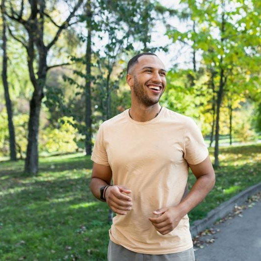 A man jogging outdoors, representing a worry-free lifestyle after consolidating high-interest debt.