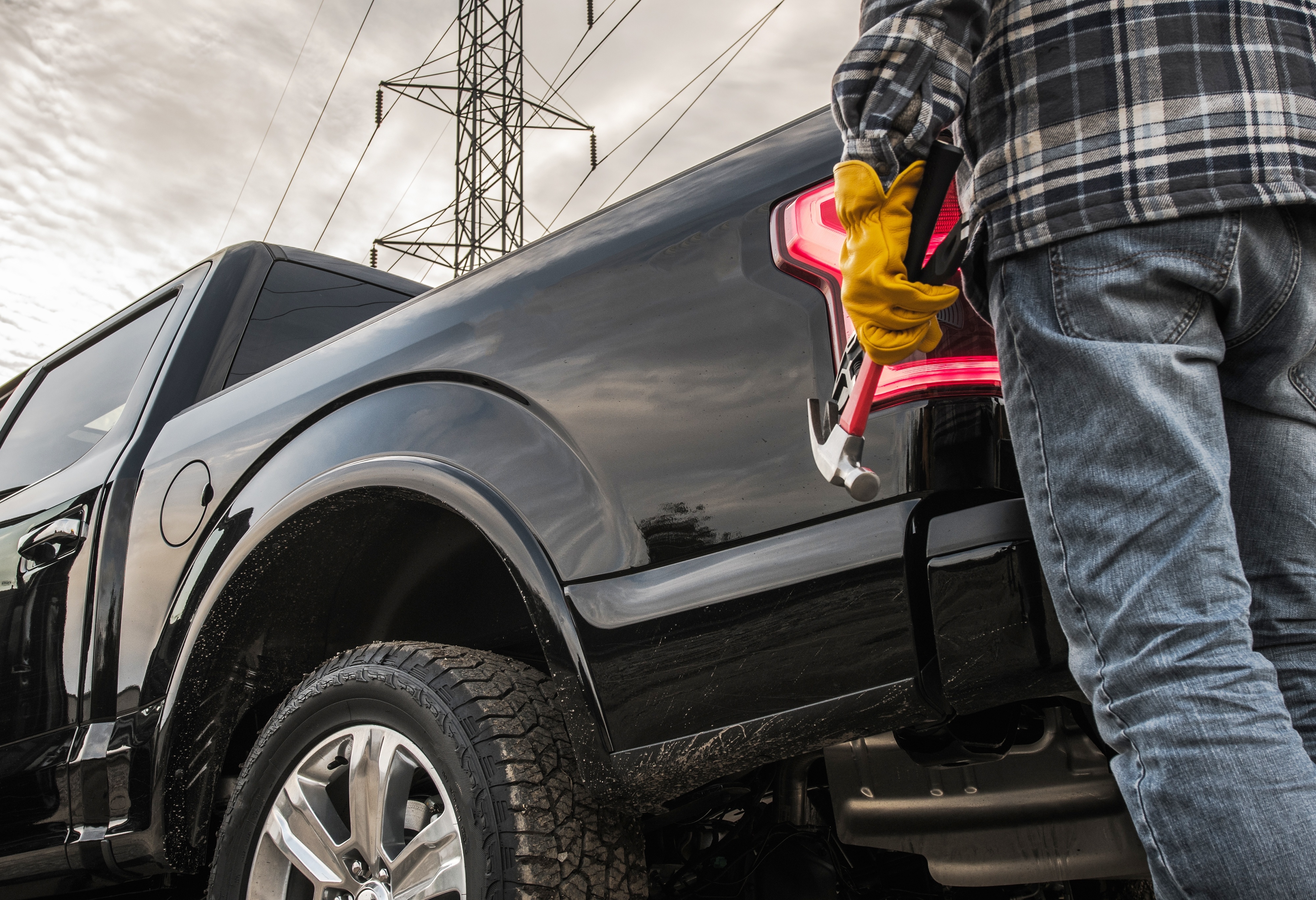 Worker standing near work truck