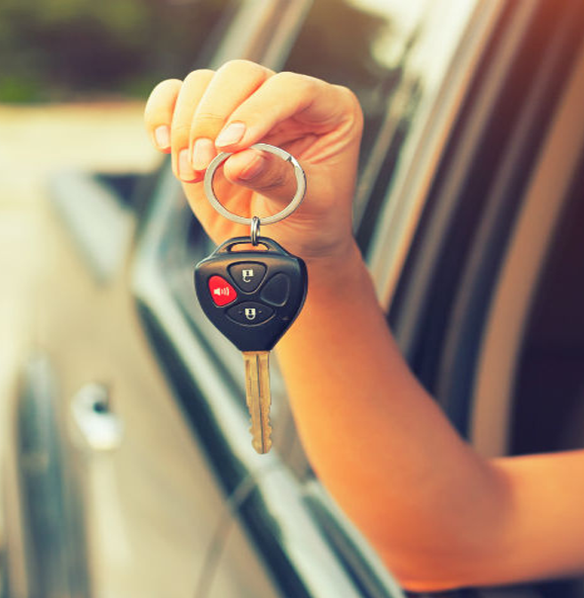 Holding-keys-to-car-outside-of-a-window