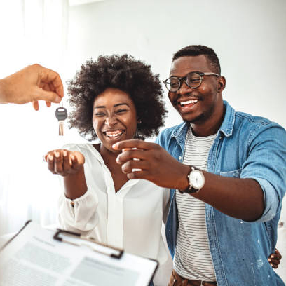 Young couple getting keys to home
