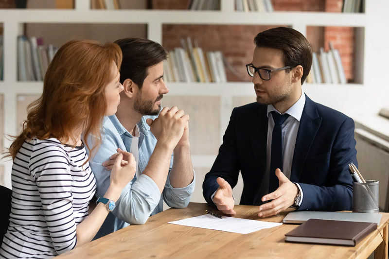 Financial advisor meeting with clients to discuss financial planning