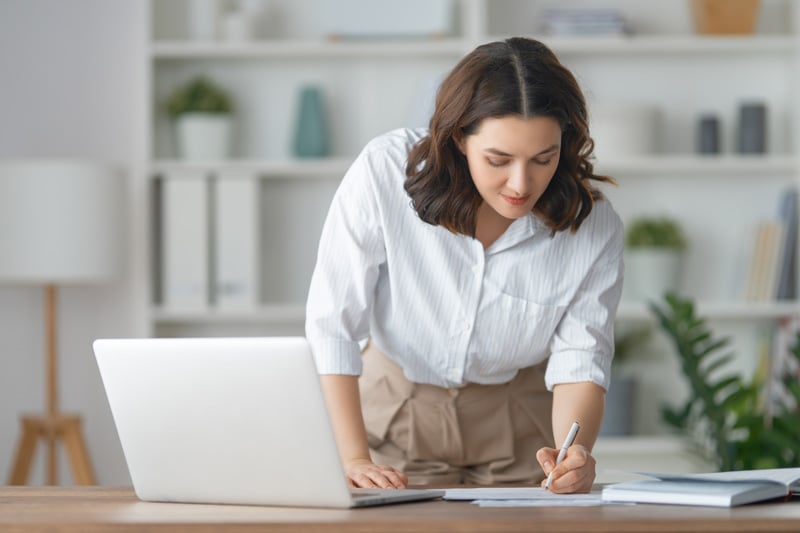 Person reviewing IRA retirement savings documents on a laptop at home